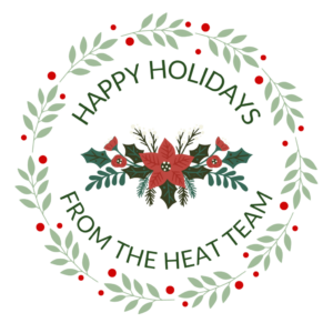 A green and red holiday wreath with the text 'Happy holidays from the HEAT Team'